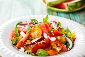 Save money on groceries with this fresh and budget-friendly watermelon salad featuring cherry tomatoes, red onion, feta, and mint – a perfect mix of quality and savings